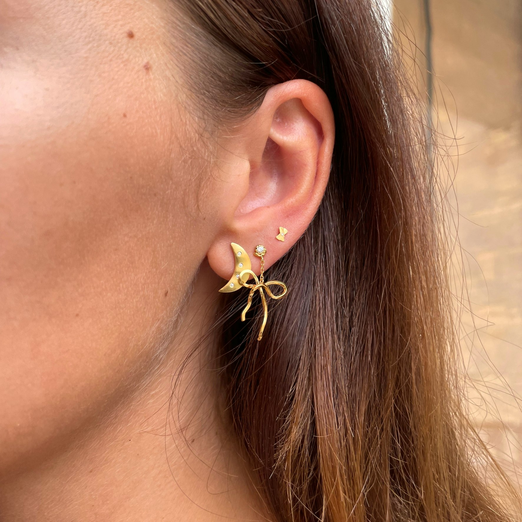 Dangling Flow Bow Earring from STINE A Jewelry in Goldplated Silver Sterling 925